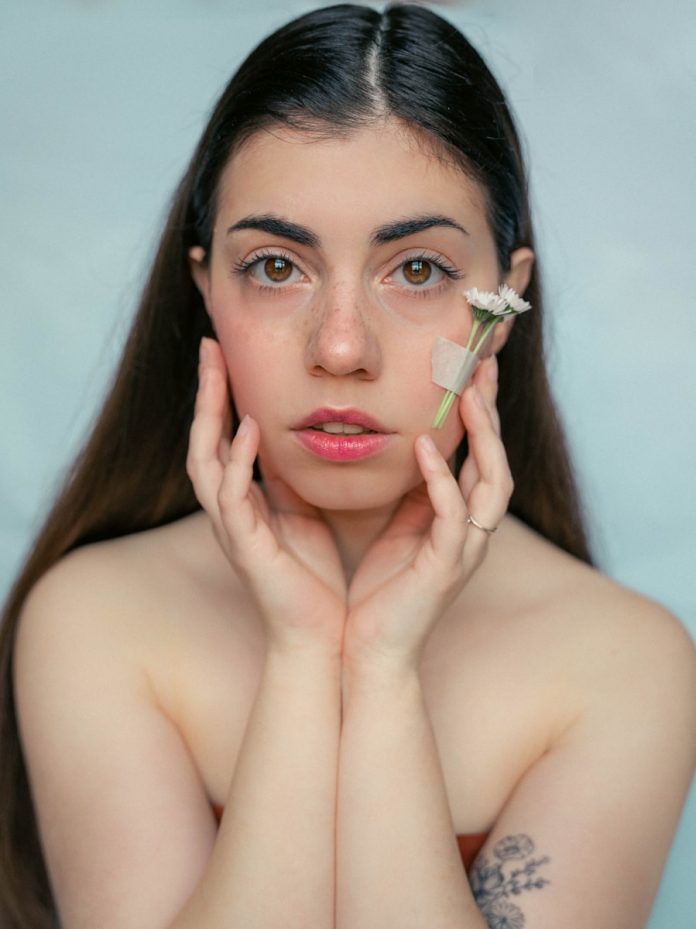 a woman with a flower in her hair
